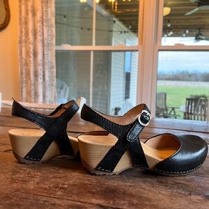 Dansko Mary Jane flat black leather w/wooden/rubber heel. Minimal sign of wear